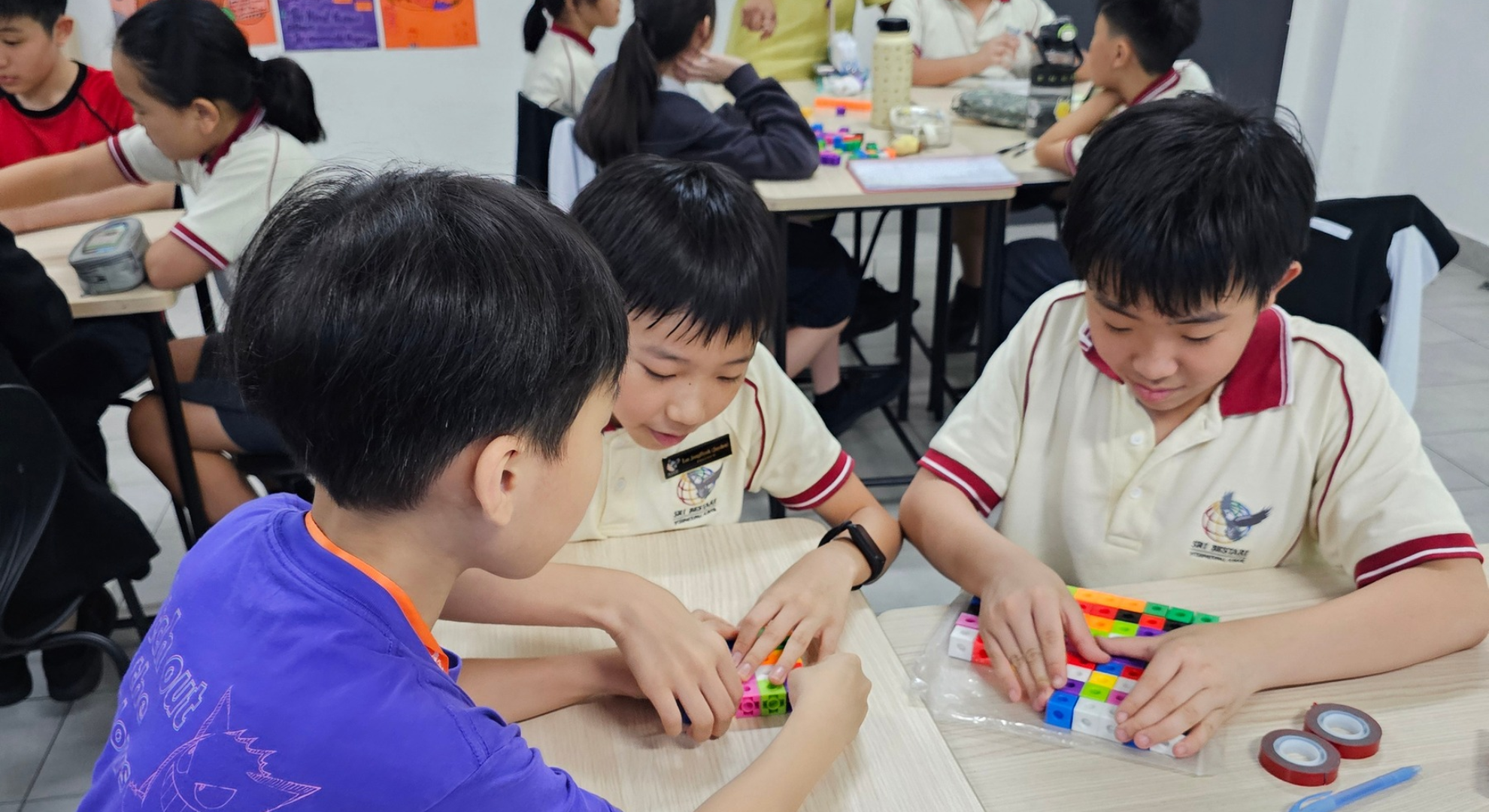 Students learning through a group project activity in class at Sri Bestari International School